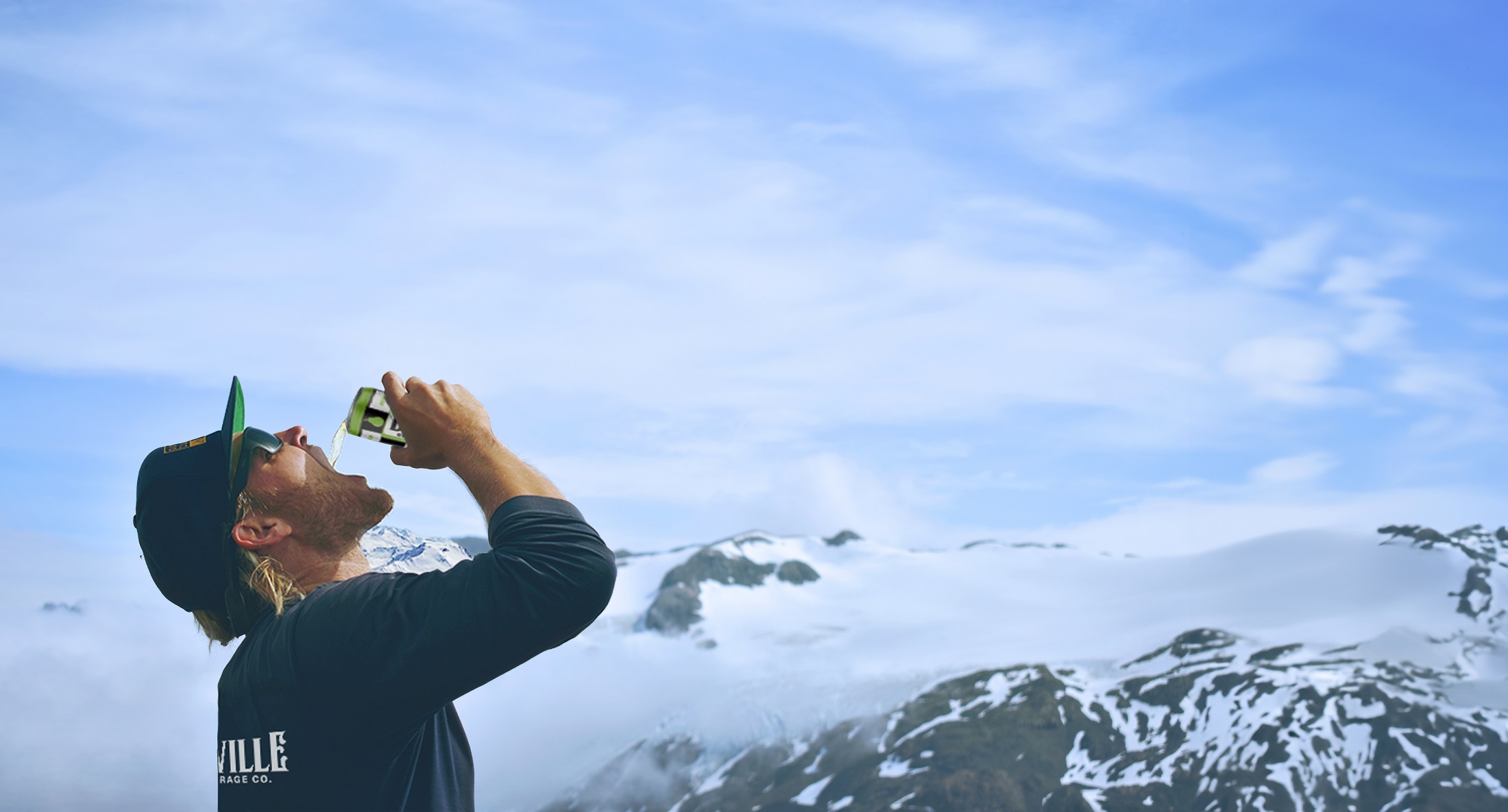 Deville Beverage Co. mountains backdrop